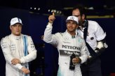 Lewis Hamilton (GBR) Mercedes AMG F1 celebrates his second place in qualifying in parc ferme. Valtteri Bottas (FIN) Williams Martini Racing, left, was third.