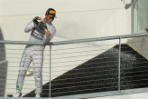 Race winner Lewis Hamilton (GBR) Mercedes AMG F1 celebrates on the podium with the champagne.